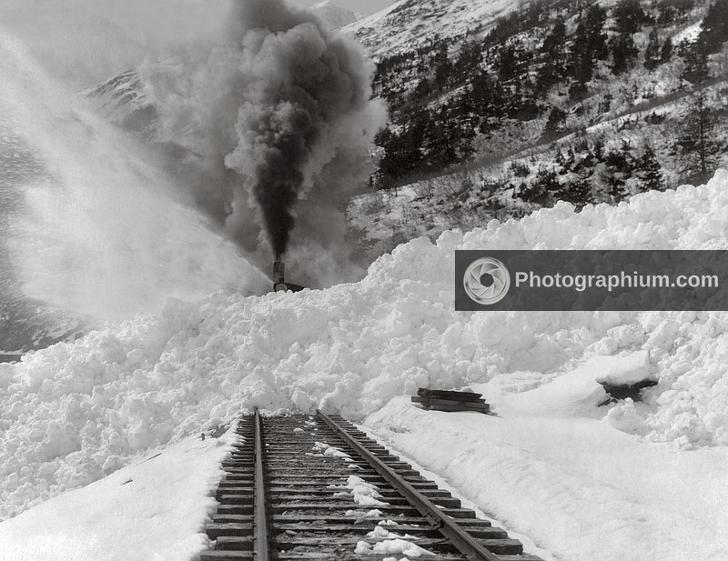 Avalanche of snow across railroad tracks. Alaska. 1900-1930