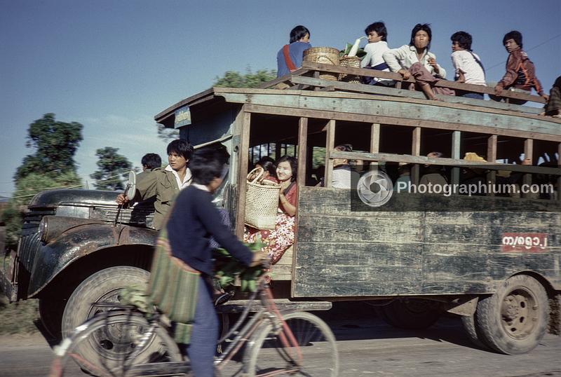 Rural bus with a weathered metal front and a traditional wooden body. Burma (Myanmar). 1986